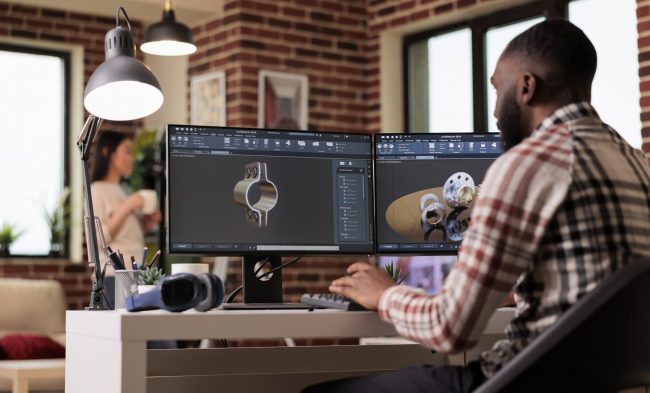 cad-engineer Male engineer working on CAD design illustrates blog "Technical Drawing vs CAD: A Practical Comparison"