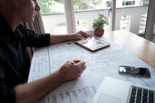 21466 Engineer reviewing CADD drawings for California Title 24