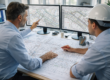 Civil engineers using specialized drafting services to review technical CAD drawings