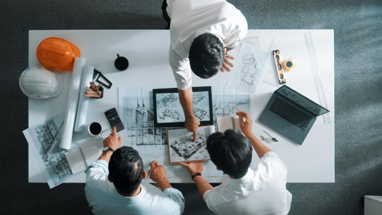 image-engineering-drawing-package-essentials Engineering team reviewing a high-quality engineering drawing package