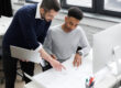 Engineering team managing design changes during project review