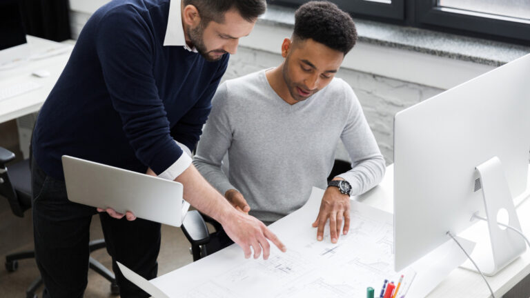 Engineering team managing design changes during project review
