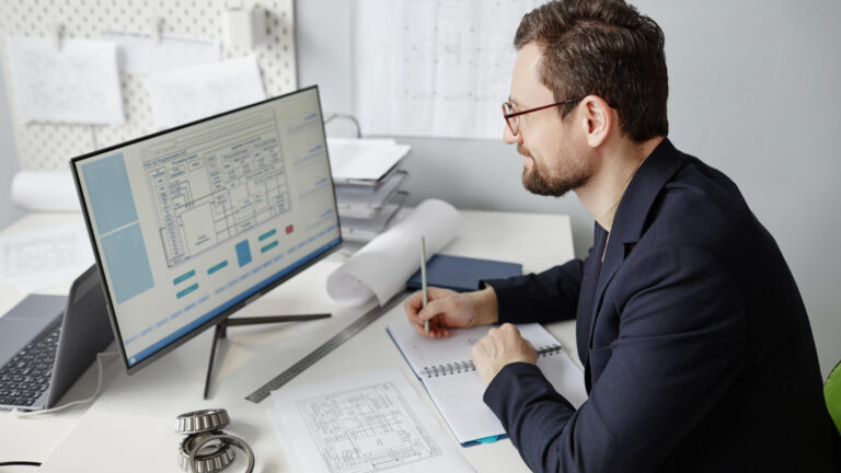 Engineer performing quality assurance drafting review on technical documents
